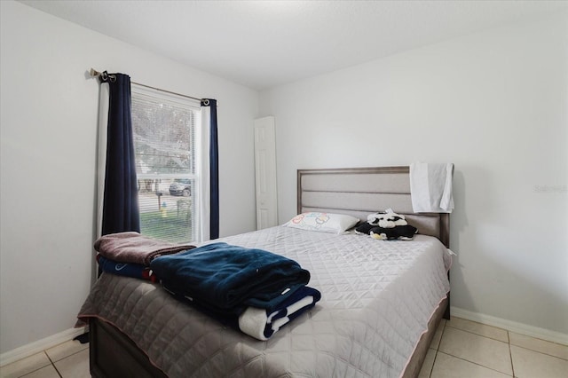 8517 N Branch Ave, Tampa, FL 33604 - bedroom with baseboards and tile patterned flooring