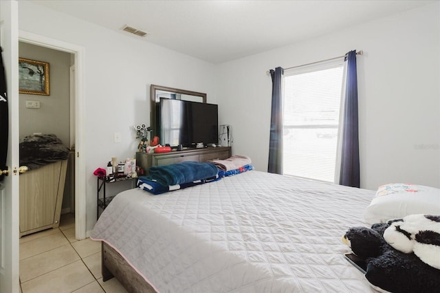 8517 N Branch Ave, Tampa, FL 33604 - bedroom with light tile patterned flooring