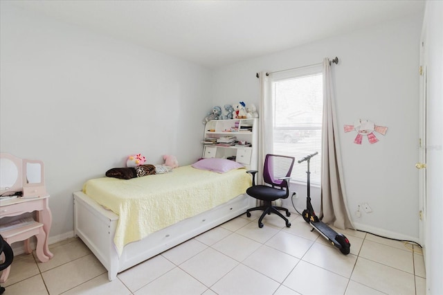 8517 N Branch Ave, Tampa, FL 33604 - bedroom featuring multiple windows and light tile patterned floors