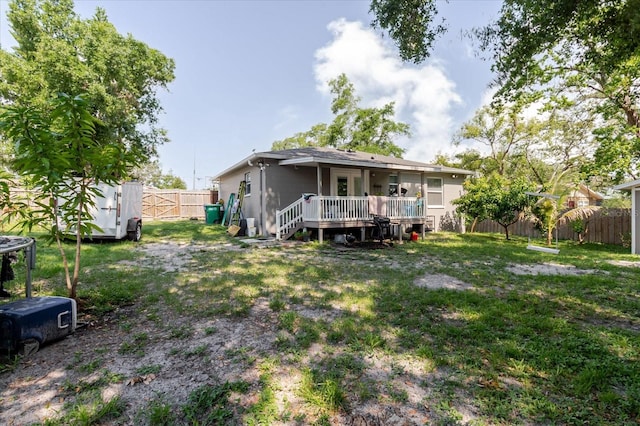 8517 N Branch Ave, Tampa, FL 33604 - rear view of property with a wooden deck