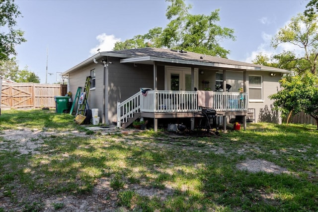 8517 N Branch Ave, Tampa, FL 33604 - rear view of house featuring a wooden deck