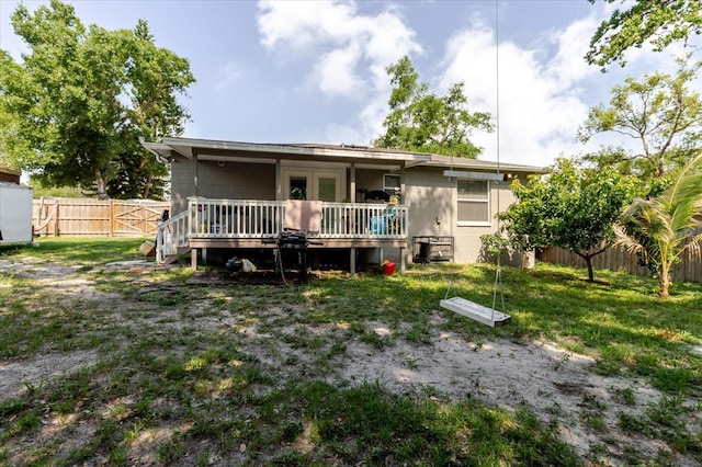 8517 N Branch Ave, Tampa, FL 33604 - rear view of property with a deck