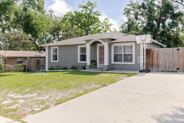8517 N Branch Ave, Tampa, FL 33604 - ranch-style home with stucco siding, roof with shingles, and driveway