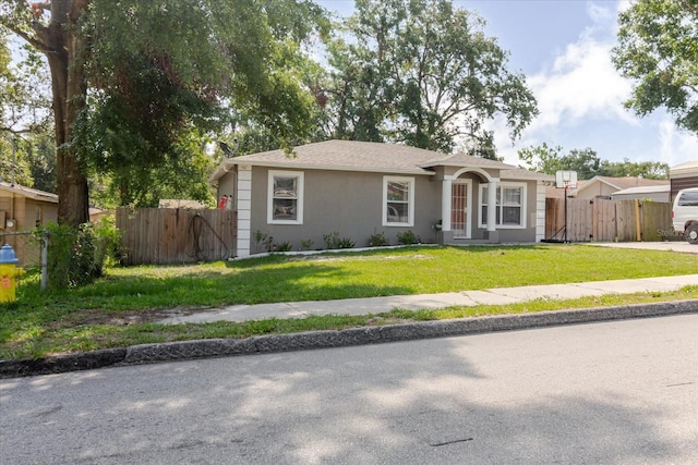 8517 N Branch Ave, Tampa, FL 33604 - single story home with stucco siding and a gate