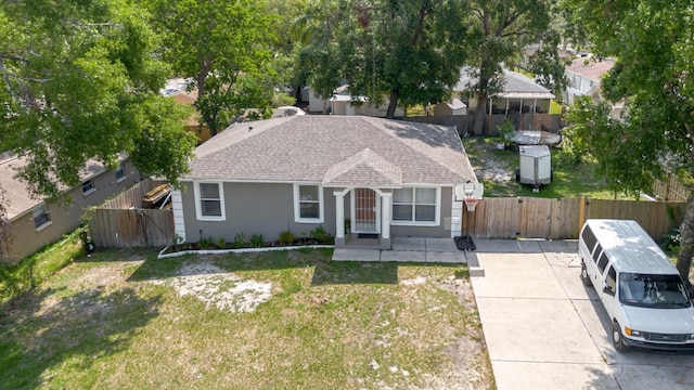 8517 N Branch Ave, Tampa, FL 33604 - view of front of property with a shingled roof and stucco siding
