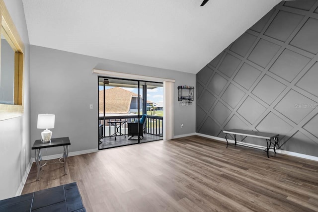 609 Lively Dr Unit B, Sun City Center, FL 33573 - empty room featuring a decorative wall, wood finished floors, and baseboards