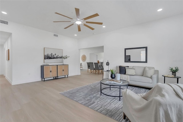 323 48th St NW, Bradenton, FL 34209 - living area with ceiling fan, light wood finished floors, recessed lighting, and baseboards