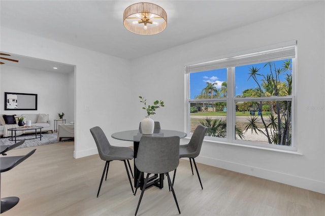 323 48th St NW, Bradenton, FL 34209 - dining space featuring light wood-style floors and baseboards