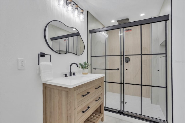 323 48th St NW, Bradenton, FL 34209 - bathroom featuring a stall shower, vanity, and recessed lighting