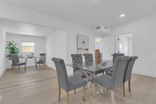 323 48th St NW, Bradenton, FL 34209 - dining room featuring light wood-type flooring, baseboards, and recessed lighting