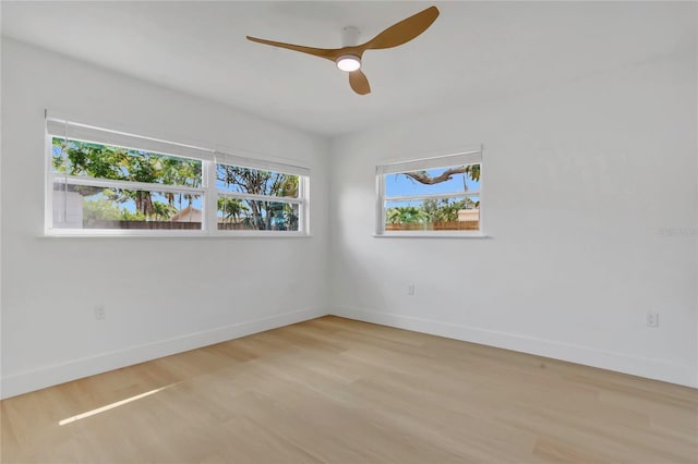 323 48th St NW, Bradenton, FL 34209 - unfurnished room with baseboards, wood finished floors, and a ceiling fan
