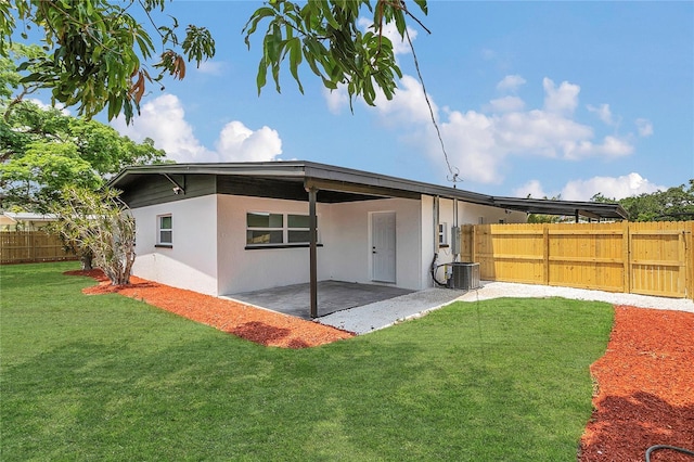 323 48th St NW, Bradenton, FL 34209 - rear view of house with a patio, stucco siding, and central air condition unit