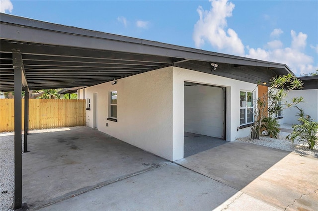 323 48th St NW, Bradenton, FL 34209 - view of patio / terrace with an attached carport and concrete driveway