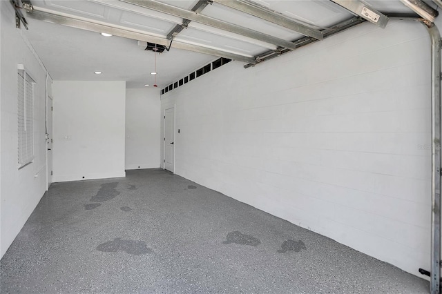 323 48th St NW, Bradenton, FL 34209 - garage featuring a garage door opener and recessed lighting