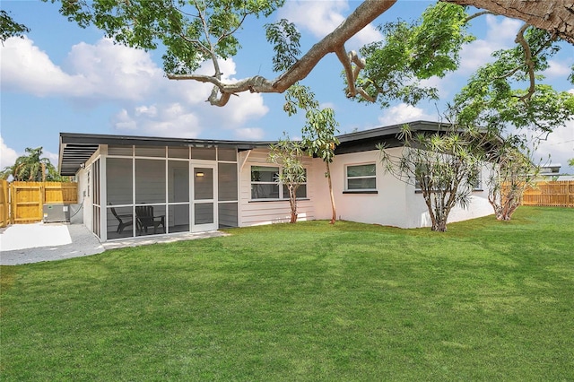 323 48th St NW, Bradenton, FL 34209 - back of house featuring a sunroom, a patio, and stucco siding