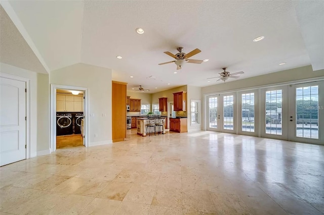 803 Harbor Dr, Belleair Beach, FL 33786 - living area featuring separate washer and dryer, baseboards, a ceiling fan, and recessed lighting