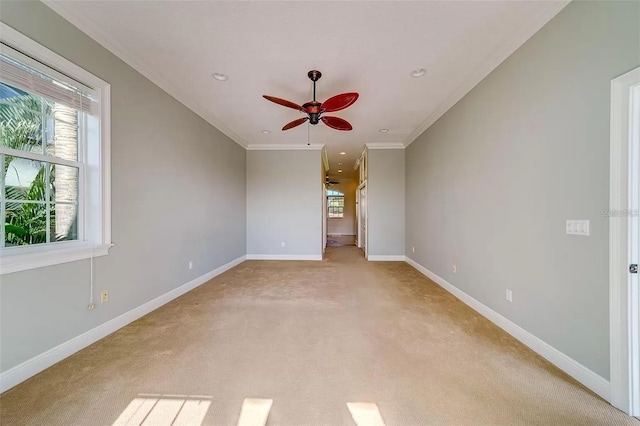 803 Harbor Dr, Belleair Beach, FL 33786 - unfurnished room featuring healthy amount of natural light, ceiling fan, light carpet, baseboards, and crown molding