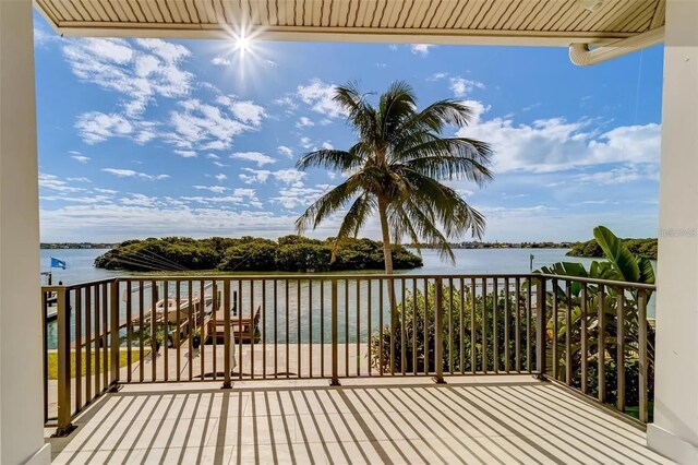 803 Harbor Dr, Belleair Beach, FL 33786 - wooden deck featuring a water view