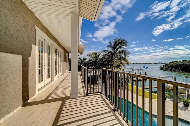 803 Harbor Dr, Belleair Beach, FL 33786 - balcony featuring a water view, french doors, and view of pool area