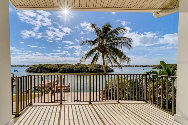 803 Harbor Dr, Belleair Beach, FL 33786 - wooden terrace featuring a water view