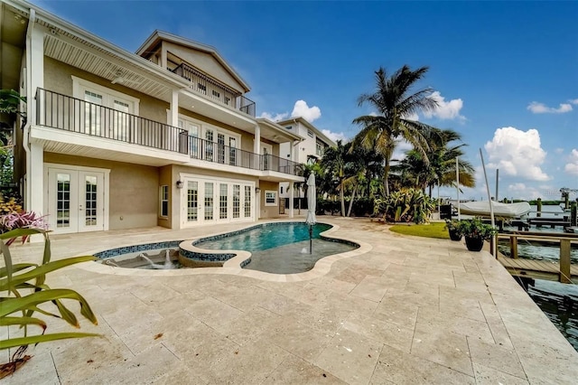 803 Harbor Dr, Belleair Beach, FL 33786 - view of swimming pool with french doors, a patio area, and a pool with connected hot tub