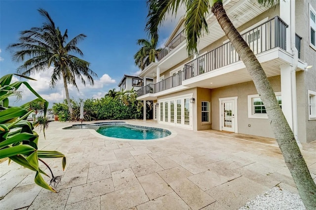 803 Harbor Dr, Belleair Beach, FL 33786 - swimming pool with a patio area, an outdoor hot tub, and french doors