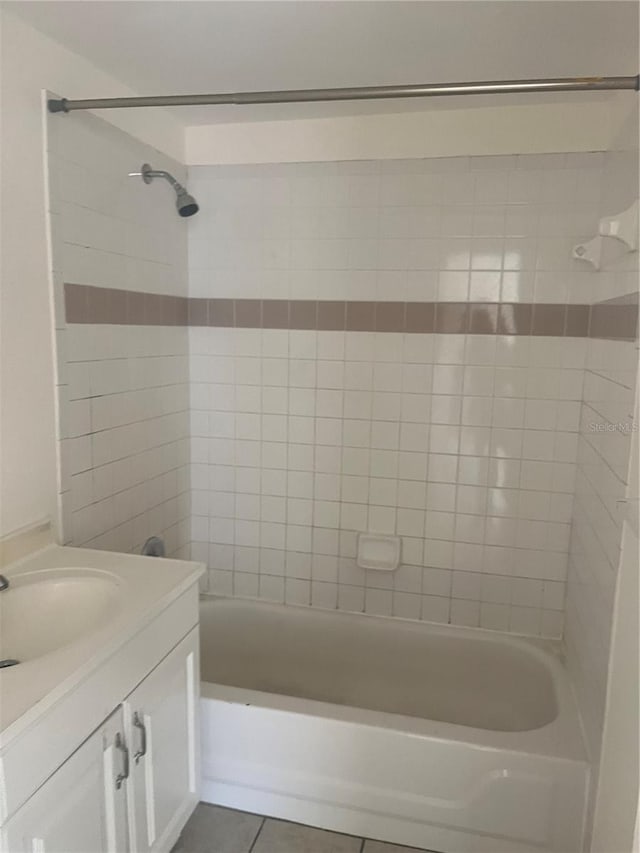 6220 Massachusetts Ave, New Port Richey, FL 34653 - bathroom featuring vanity, shower / bathtub combination, and tile patterned floors