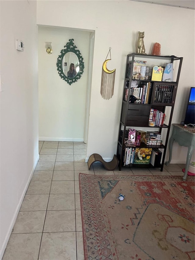 6220 Massachusetts Ave, New Port Richey, FL 34653 - hallway featuring tile patterned flooring and baseboards