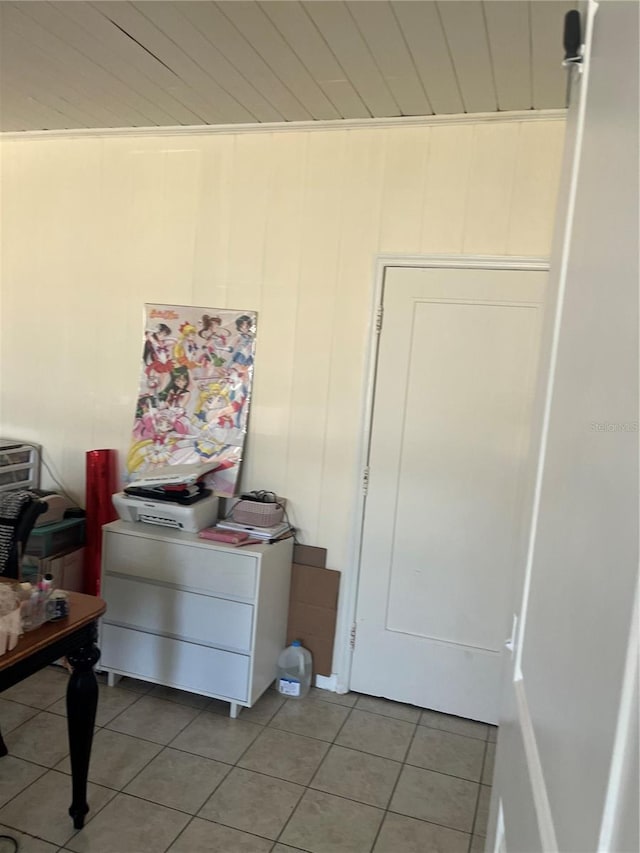 6220 Massachusetts Ave, New Port Richey, FL 34653 - bedroom with light tile patterned floors