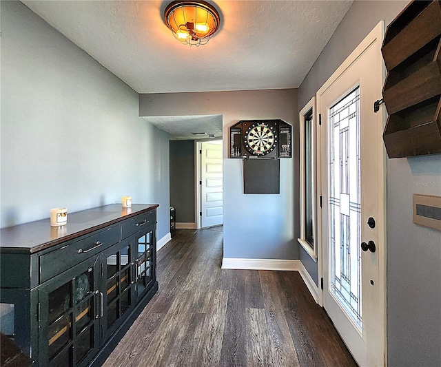 1608 20th Ave W, Palmetto, FL 34221 - hall featuring dark wood finished floors, baseboards, and a textured ceiling