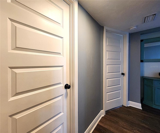 1608 20th Ave W, Palmetto, FL 34221 - hallway with dark wood-type flooring and baseboards