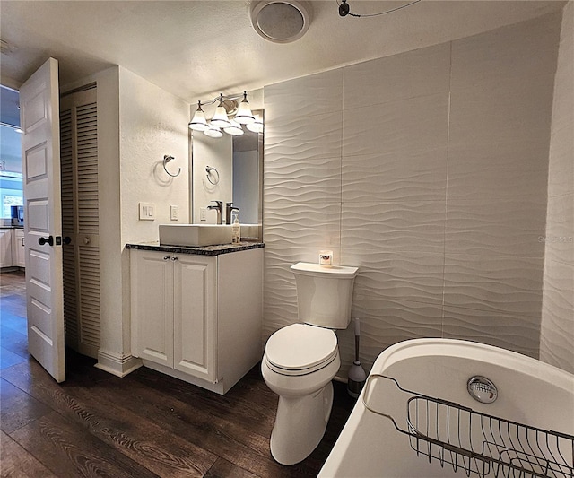 1608 20th Ave W, Palmetto, FL 34221 - bathroom with wood-type flooring, vanity, and toilet