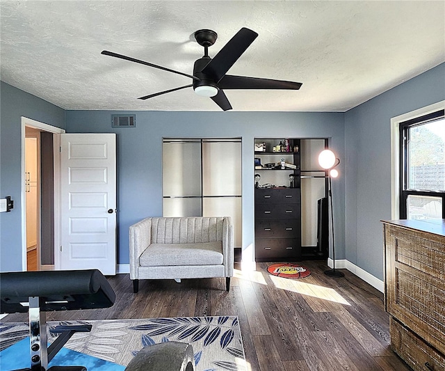 1608 20th Ave W, Palmetto, FL 34221 - living area with a ceiling fan, wood finished floors, a textured ceiling, and baseboards