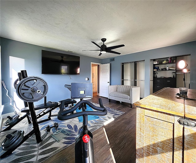 1608 20th Ave W, Palmetto, FL 34221 - living area featuring ceiling fan, wood finished floors, and a textured ceiling
