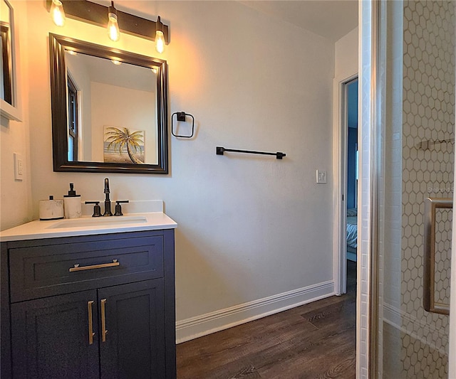 1608 20th Ave W, Palmetto, FL 34221 - full bath featuring wood finished floors, vanity, and baseboards