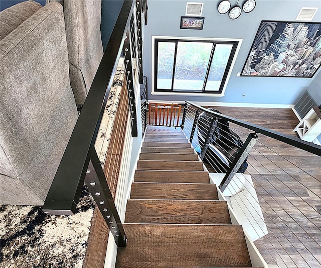 1608 20th Ave W, Palmetto, FL 34221 - stairs featuring baseboards and wood finished floors