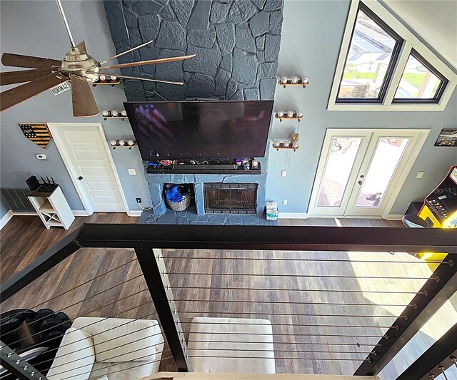 1608 20th Ave W, Palmetto, FL 34221 - unfurnished living room featuring high vaulted ceiling, baseboards, wood finished floors, ceiling fan, and french doors