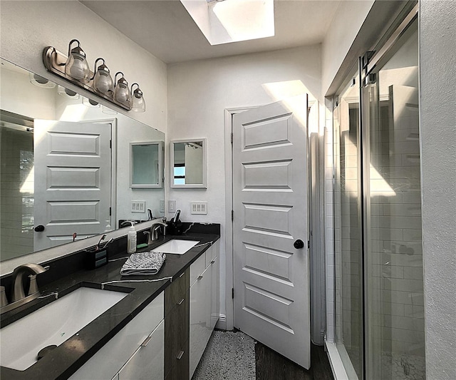 1608 20th Ave W, Palmetto, FL 34221 - bathroom featuring double vanity, a skylight, and a stall shower