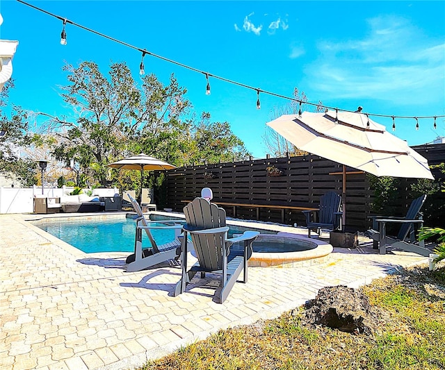 1608 20th Ave W, Palmetto, FL 34221 - view of swimming pool with a fenced backyard, a patio, and a pool with connected hot tub