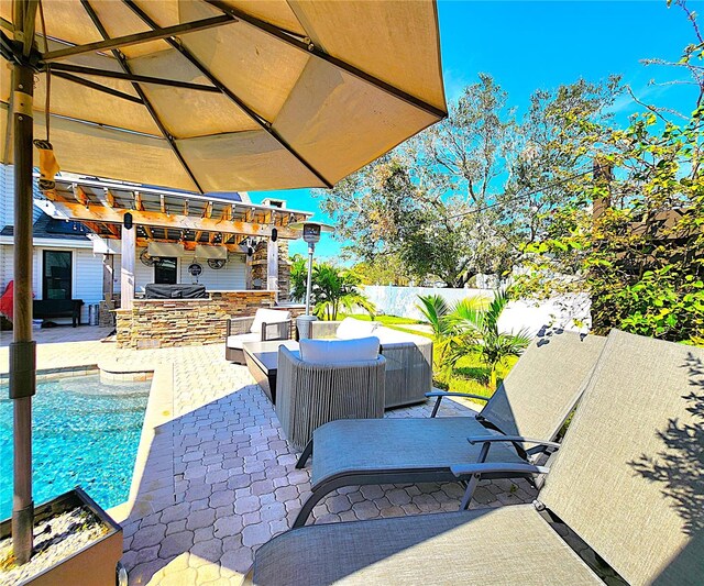 1608 20th Ave W, Palmetto, FL 34221 - view of patio featuring an outdoor kitchen, outdoor lounge area, and a pergola