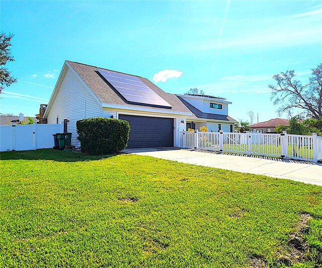 1608 20th Ave W, Palmetto, FL 34221 - view of front of house with roof mounted solar panels, concrete driveway, and an attached garage
