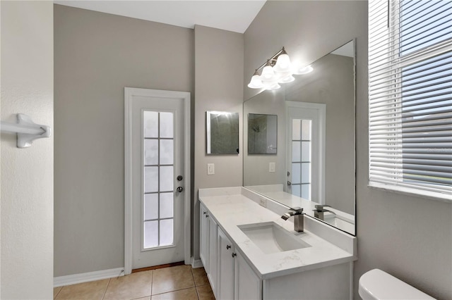 7732 Bulls Head Dr, Wesley Chapel, FL 33545 - bathroom with toilet, vanity, tile patterned floors, and baseboards
