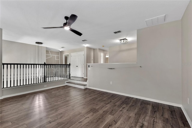 7732 Bulls Head Dr, Wesley Chapel, FL 33545 - unfurnished room featuring a ceiling fan, wood finished floors, and baseboards