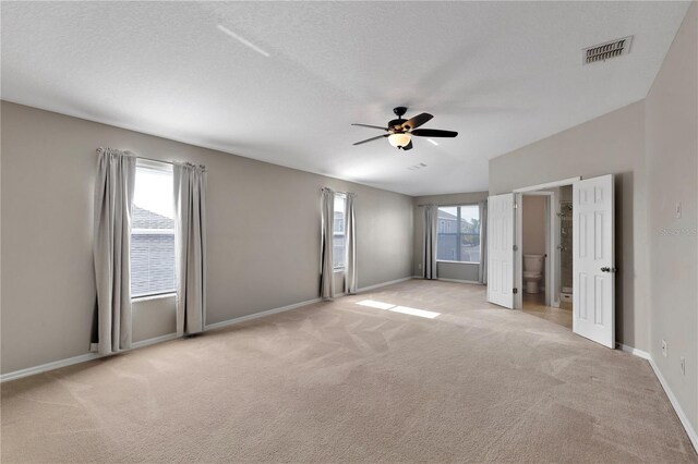 7732 Bulls Head Dr, Wesley Chapel, FL 33545 - unfurnished bedroom featuring light colored carpet, baseboards, and a ceiling fan