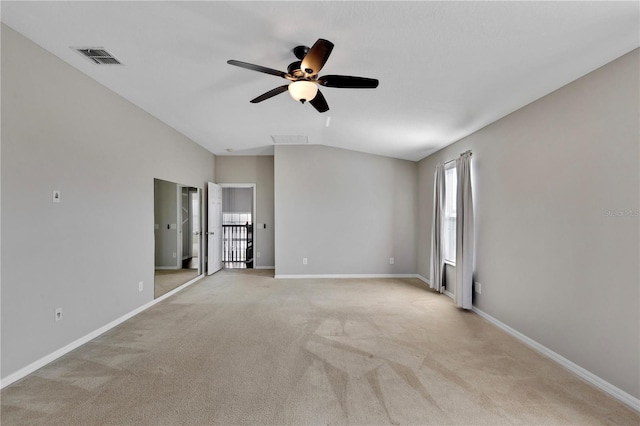 7732 Bulls Head Dr, Wesley Chapel, FL 33545 - unfurnished bedroom featuring light colored carpet, baseboards, lofted ceiling, and ceiling fan