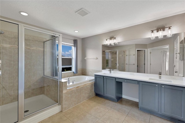 7732 Bulls Head Dr, Wesley Chapel, FL 33545 - full bath featuring double vanity, a bath, a stall shower, tile patterned floors, and recessed lighting