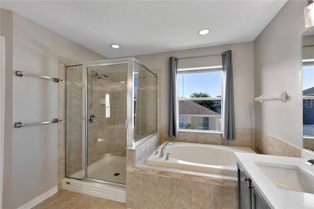 7732 Bulls Head Dr, Wesley Chapel, FL 33545 - bathroom featuring a garden tub, a shower stall, tile patterned flooring, vanity, and recessed lighting