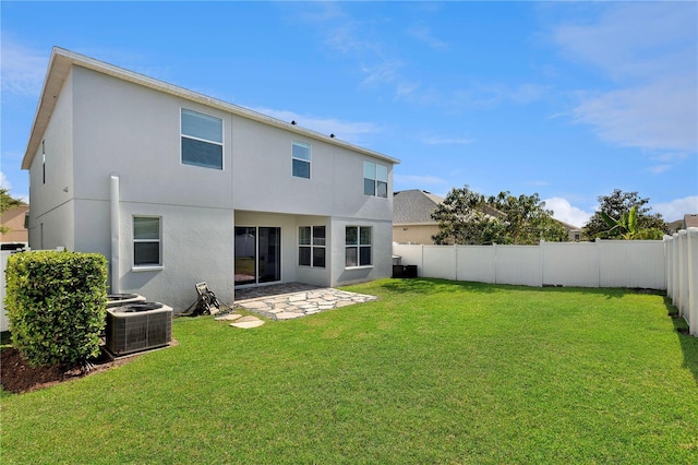 7732 Bulls Head Dr, Wesley Chapel, FL 33545 - rear view of house with cooling unit, stucco siding, and a patio