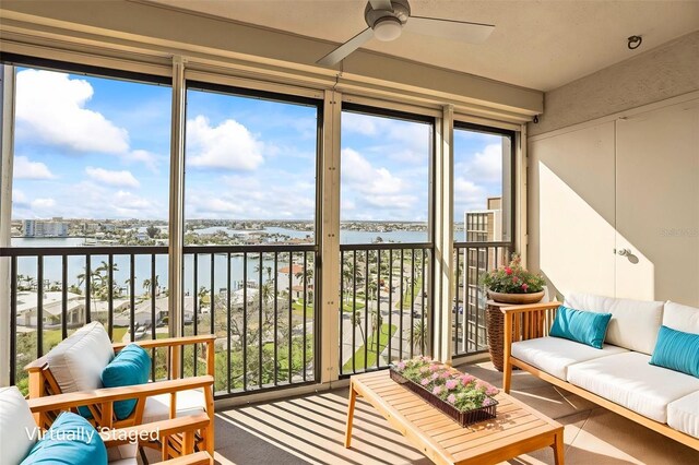 10355 Paradise Blvd Unit 1003, Treasure Island, FL 33706 - sunroom / solarium featuring a water view and a wall of windows