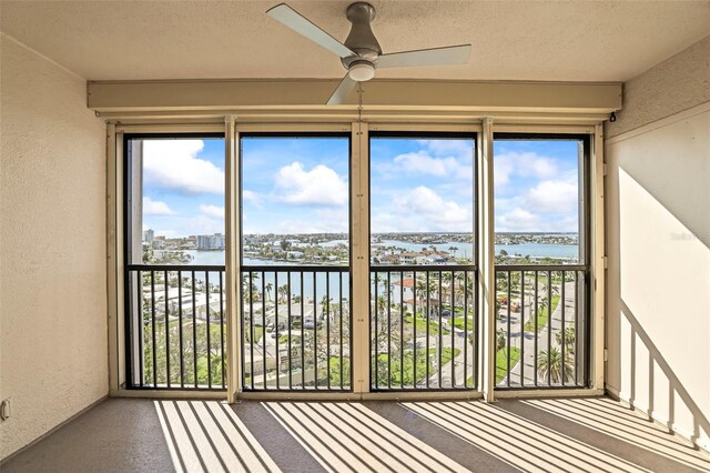 10355 Paradise Blvd Unit 1003, Treasure Island, FL 33706 - unfurnished sunroom with a water view and healthy amount of natural light